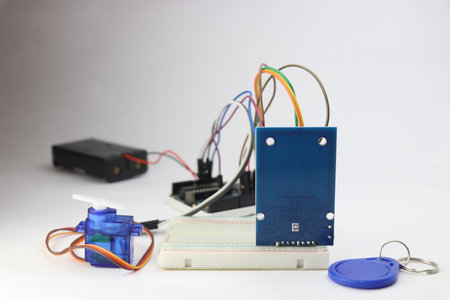 RFID module with tag, Micro servo and other electronic component connected with breadboard....