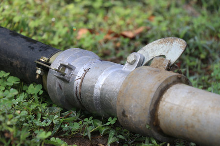 HDPE and aluminum pipes are connected using a converter or coupling. Different types of piping materials are combined using pipe fittingsの写真素材