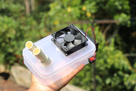 Air cooler device built at home using PC cooling fan fixed to a container that uses ice to cool the...