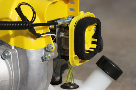 Gasoline pump hose for fuel supply in a brush trimmer. Parts of a gasoline powered bush trimmer with...