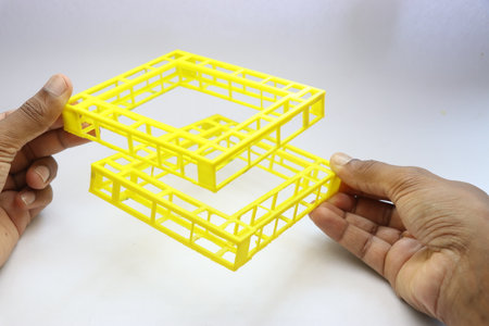 3D printed geo metrical shape object held in the hand on white background. Things printed using 3d printer machineの写真素材
