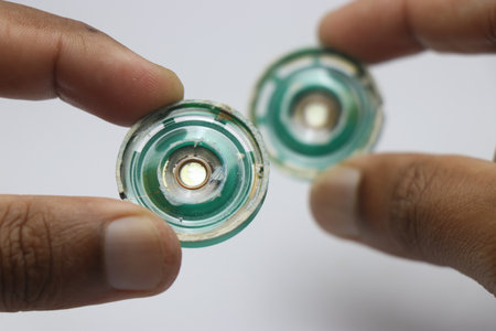 Speakers that is small in size made of plastic that finds its application on small electronic music devices held in the hand with a closeup viewの写真素材