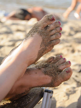 Feet in the sand. Travel on Europe