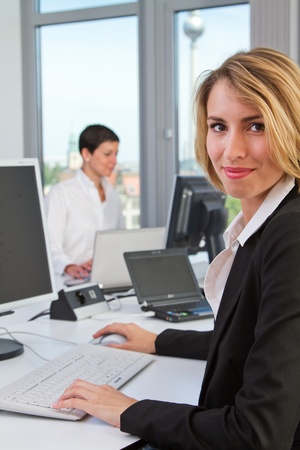 young women at the workplace in the officeの写真素材
