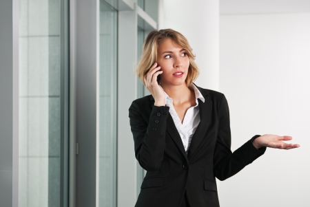 Business woman on the phone with smartphoneの写真素材