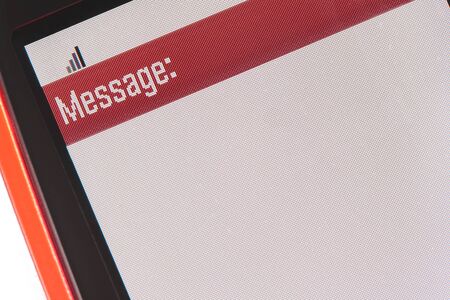 Red cellphone with blank screen ready for a messageの写真素材