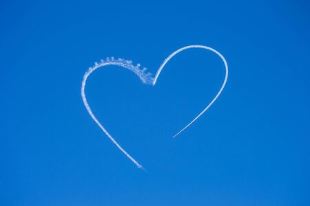 Cloud heart in a blue skyの写真素材