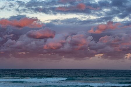 Beautiful sunset at the beach pink and blue colorsの写真素材