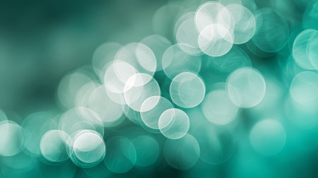 Abstract green bokeh background with circular light patterns.の素材
