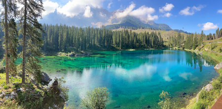 panoramic view of turquoise colored lake in the Alpsの写真素材