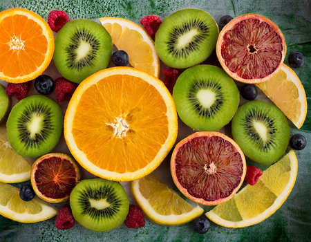 Fruit mix on a grunge background. Orange, kiwi, lemon, grapefruit, orangeの素材