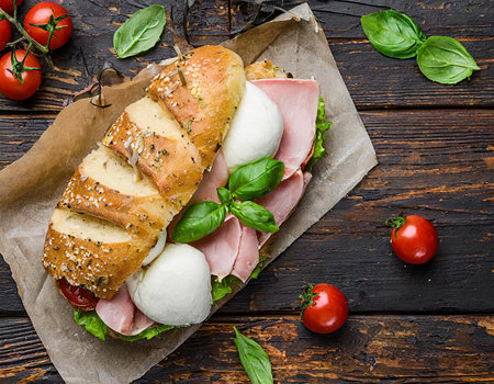 Sandwich with ham, mozzarella cheese, tomatoes and basilの素材