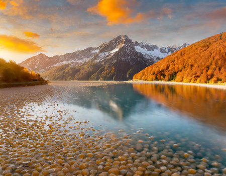 Mountain lake at sunset. Colorful autumn landscape in Alps.の素材