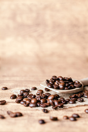 wooden spoon with coffee beansの写真素材