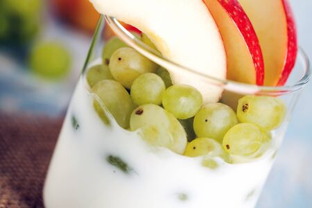 yogurt with apples and grapesの写真素材
