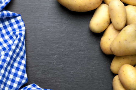 potatoes with a blue checkered tableclothの写真素材