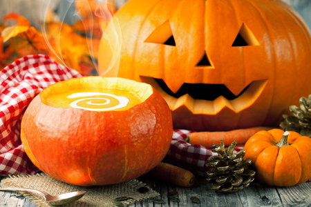 pumpkin soup with halloween pumpkinの写真素材