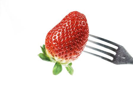 Strawberry on forkの写真素材