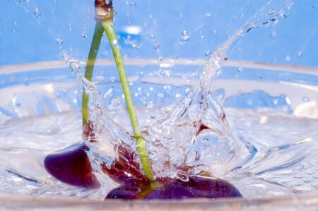 Cherry splash to waterの写真素材