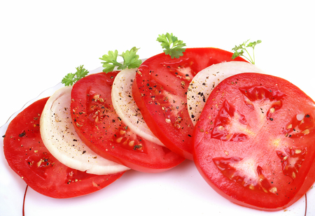 Tomato and onion slice isolatedの写真素材