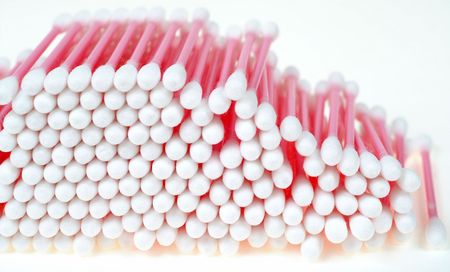 Close-up of lots of pink cotton swabs 