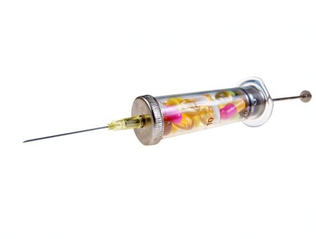 Glass syringes with vitamins isolated on whiteの写真素材