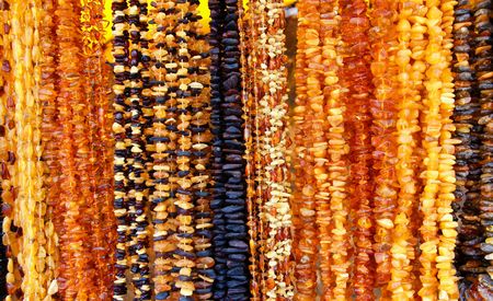 Background with beautiful necklets with amberの写真素材