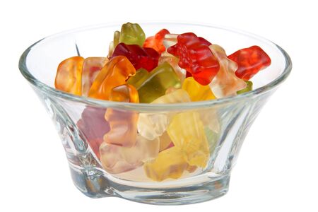 Gummy bears in glass bowl isolated on white backgroundの写真素材