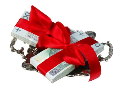 Parcels of Polish money as a gift on silver tray isolated on whiteの写真素材
