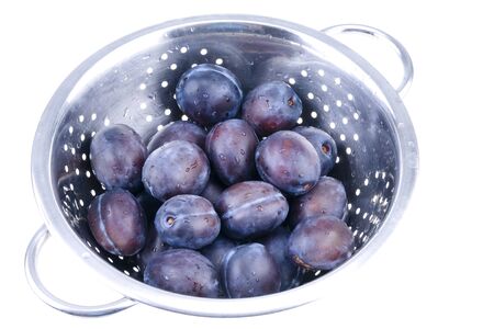  Blue plums in colanderの写真素材