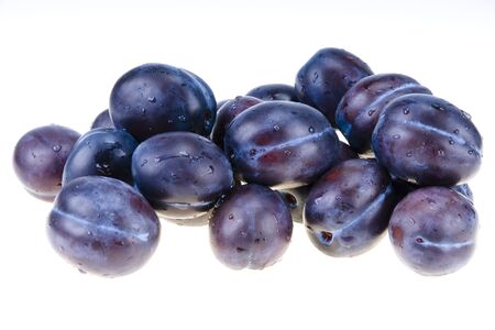 Stack of blue plums isolatedの写真素材