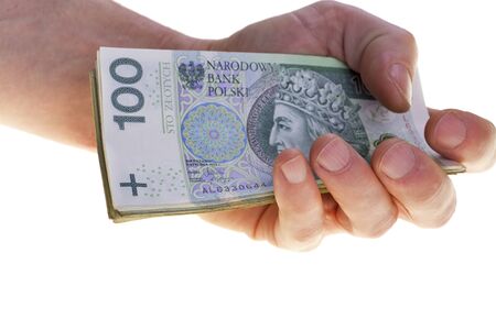 Polish currency banknotes hundred zloty stacked in hand.の写真素材