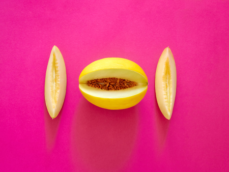 Yellow Melon Fruit isolated in plastic pink background viewed from above - flatlay look - Image Minimalism conceptの写真素材