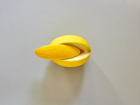 Yellow Melon Fruit isolated in grey background viewed from above - flatlay look - Image Minimalism conceptの写真素材