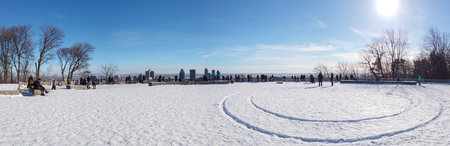 January 09, 2021 - Montreal, Canada Panorama of Mont Royal viewpoint covered in snow on a winter afternoon and clear skyのeditorial素材