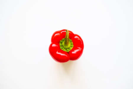 Red bell pepper isolated in studio with white background viewed from above as a flatlay conceptの写真素材