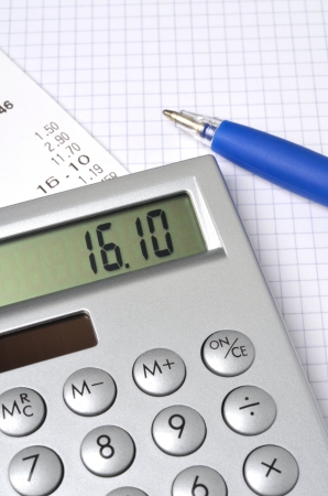 Pocket calculator on writing padの写真素材