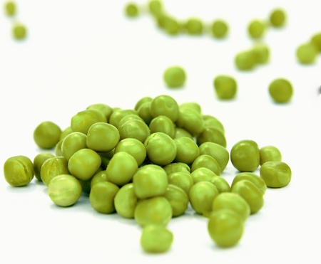 isolated cooked peas over white backgroundの写真素材