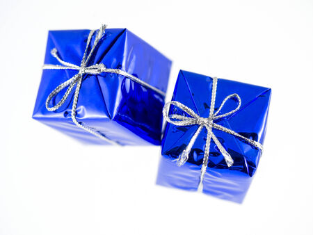 Blue Christmas gifts isolated over white backgroundの写真素材