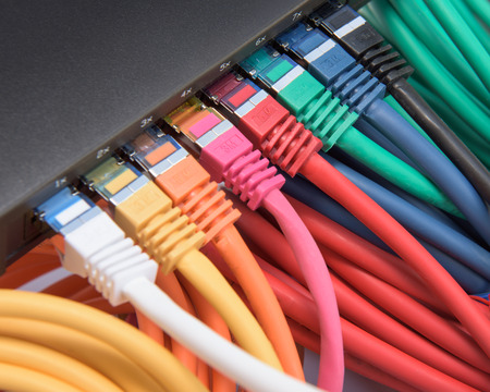 Colorful network cables connected to a switch
