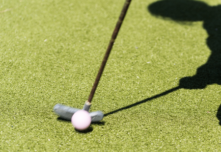miniature golf racket and a shadow of the playerの写真素材