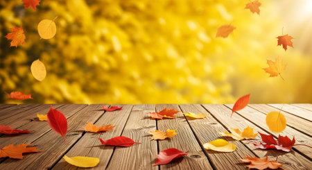 Fall product background scene wooden tabletop with falling colorful maple leaves autumn. Great for product showcase and display.の素材