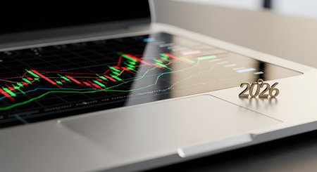 Analyzing stock market chart for 2026 investment. Financial strategy planning on laptop technology. Digital trading concept computer.の素材