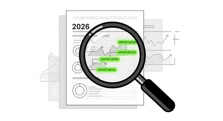 2026 business opportunities scouting conceptual image. Magnifying glass examining chart financial data searching future potential.の素材