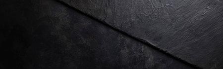 Dark black slate background or texture. Top view with copy space.の素材