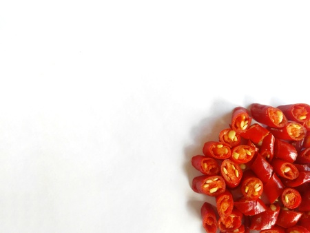 Closeup top view red chili pepper with chopped on white background.の写真素材