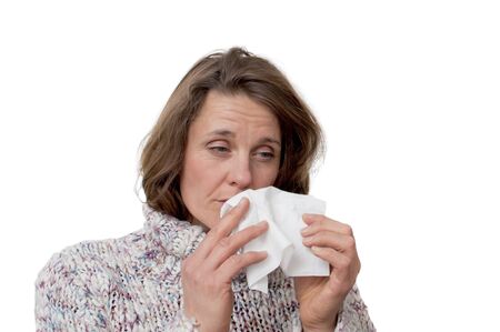 woman holding a tissue having a coldの写真素材