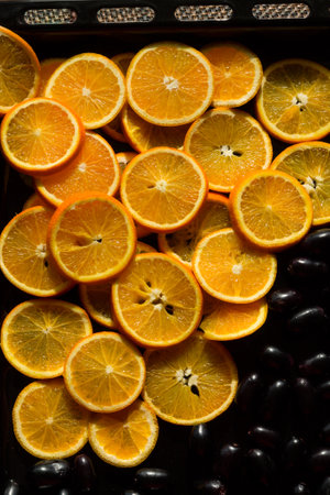 Fresh,juicy,sweet slices of Valencia oranges along with Java Plum Berries also called Jamun....