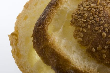 slices of wheat bread macro against white