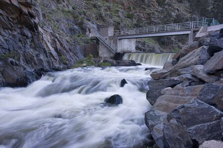 Deep and dark canyon of Big Thompson River below a dam diverting water for farmland irrigation, Colorado.の写真素材